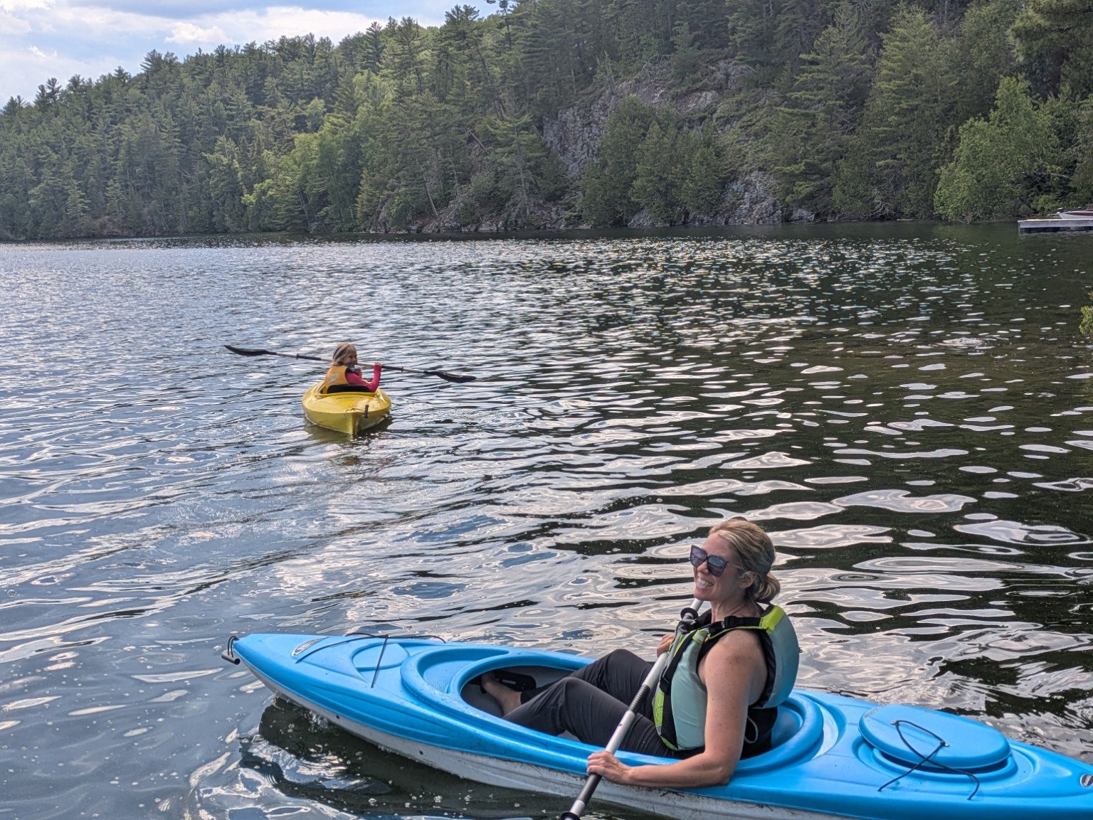 Katie kayaking on a lake